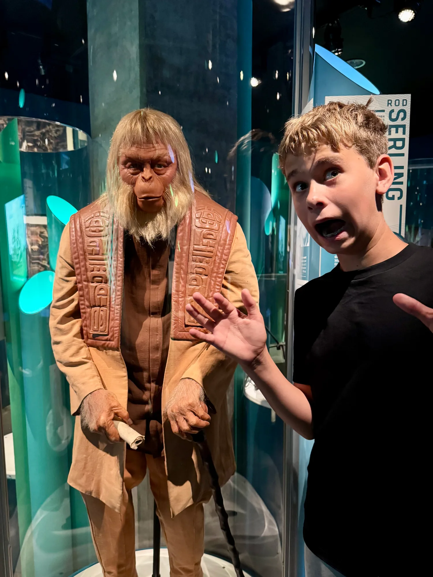 One of the boys mugging next to a Planet of the Apes display at MoPOP